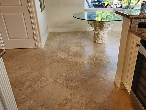 damaged travertine floor before restoration